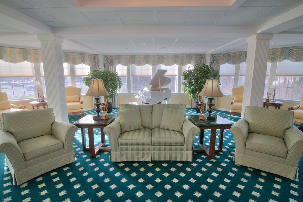 A spacious living room with comfortable seating and elegant decor.