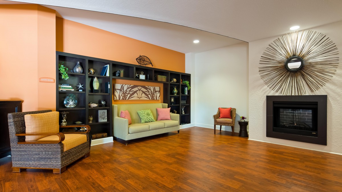 A modern living room with stylish decor and wooden flooring.