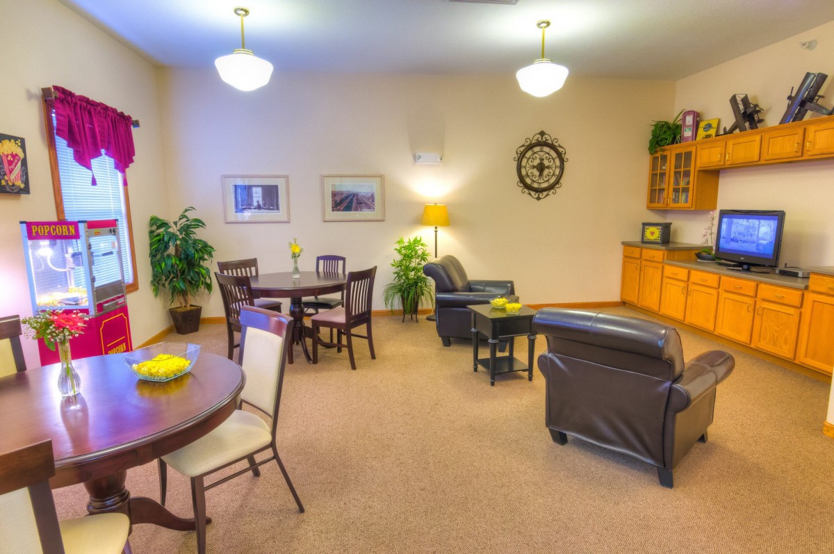 A cozy living room with comfortable seating and warm lighting.