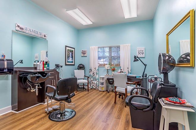 A cozy hair salon with modern furniture and bright lighting.
