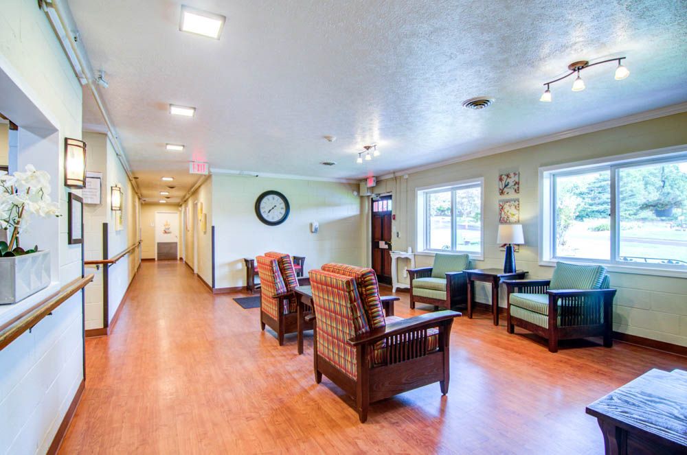 A bright and spacious waiting area with comfortable seating and large windows.