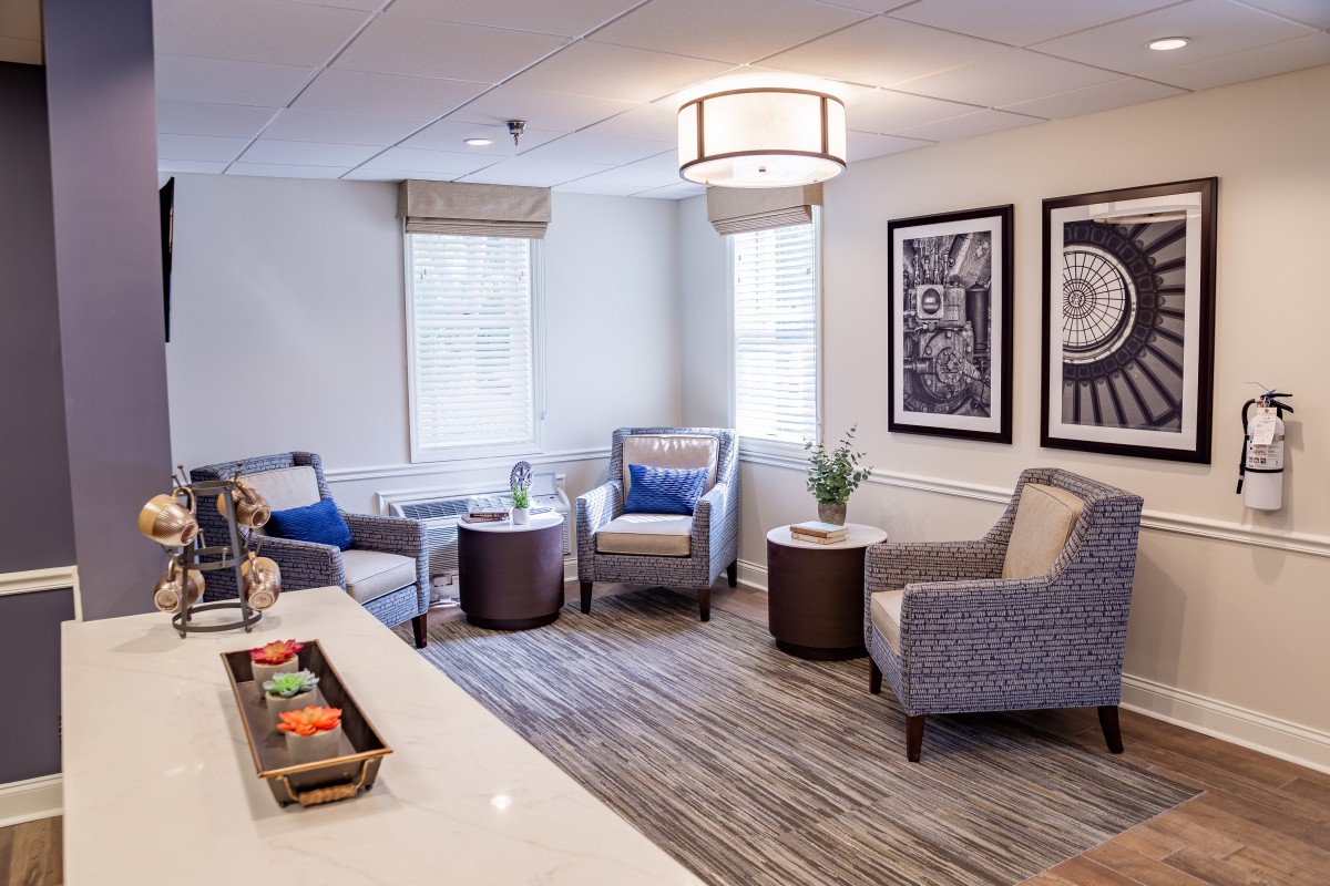 A cozy and modern living room with comfortable seating and elegant decor.