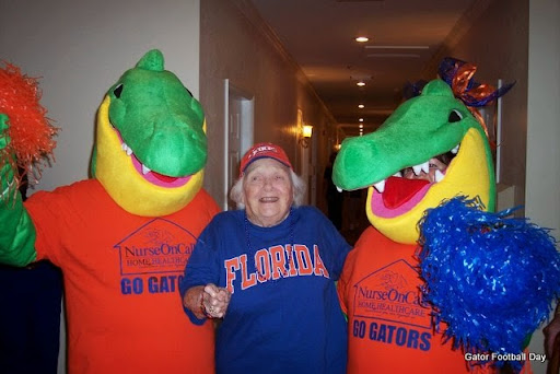 A joyful moment with fans and mascots celebrating the Florida Gators spirit.