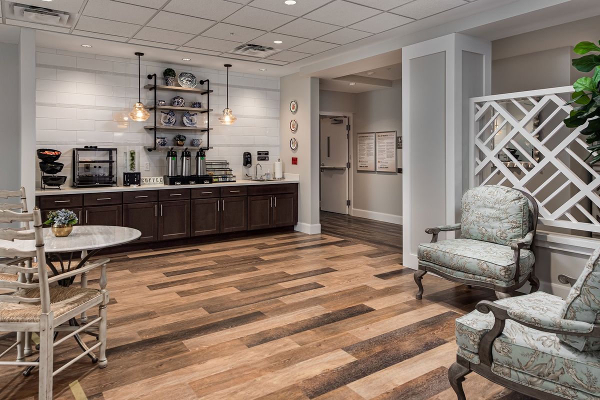 A cozy waiting area with a coffee station and comfortable seating.