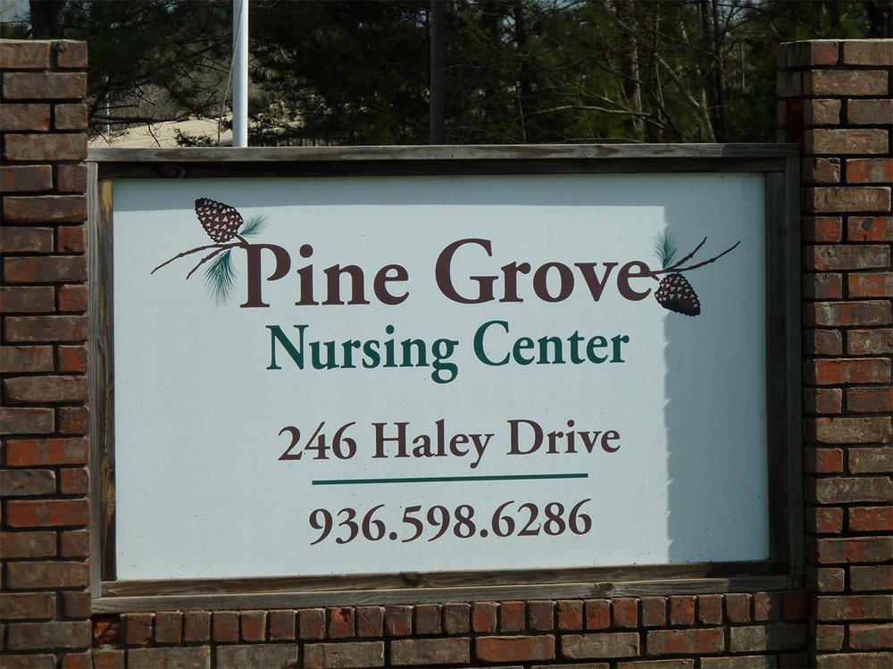 Sign for Pine Grove Nursing Center with address and contact information.