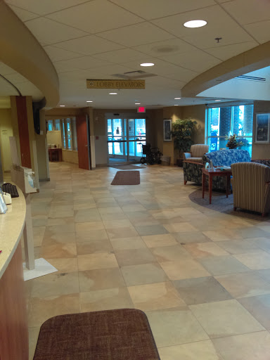A spacious lobby featuring comfortable seating and natural light.