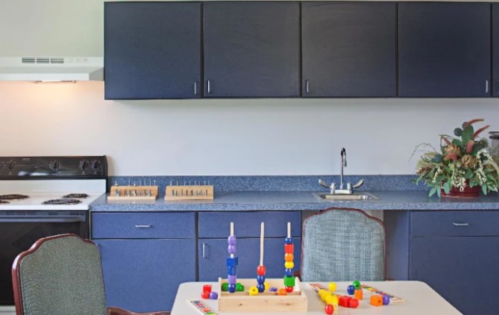 A classroom setup with educational toys and furniture.