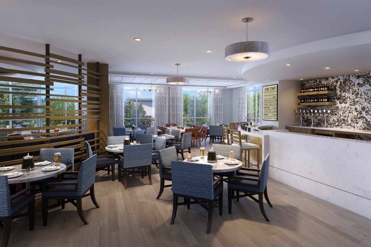 A modern restaurant interior with neatly arranged tables and chairs, accentuated by ample natural light.