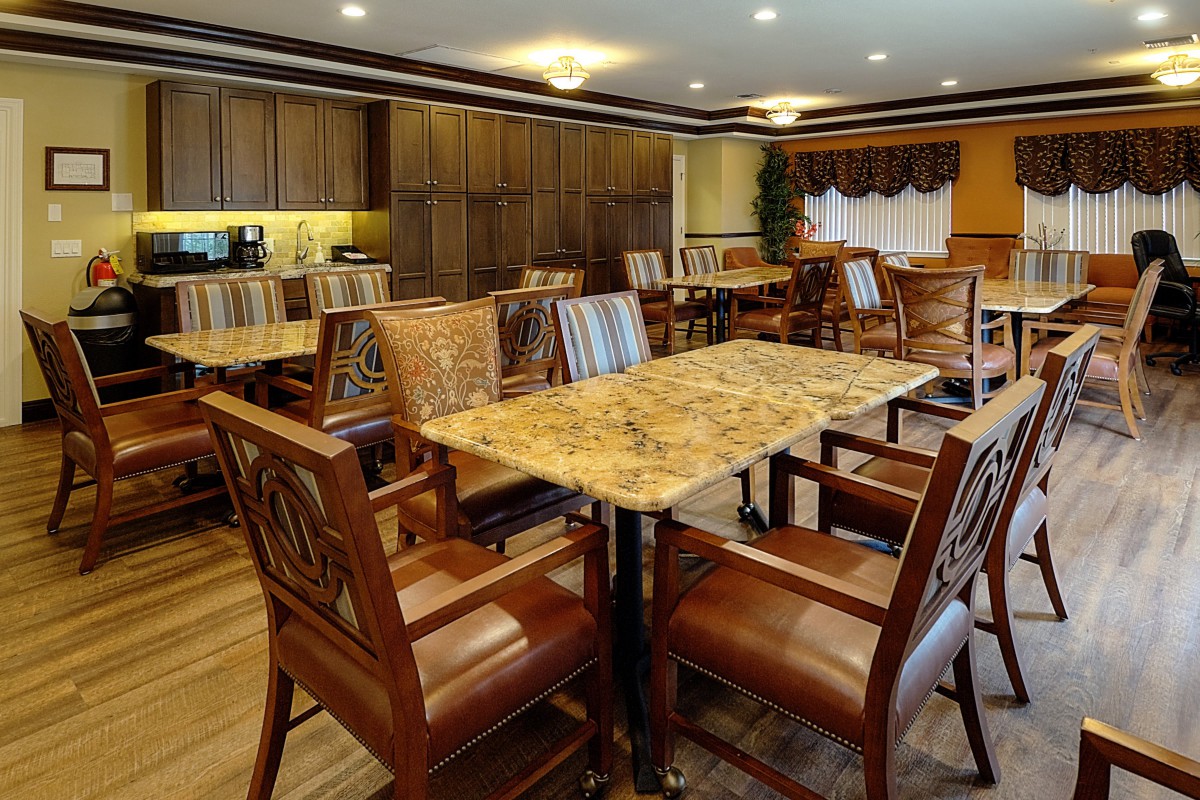 Cozy dining room with wooden furniture and warm lighting.
