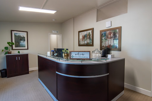 A stylish and modern office reception area with decorative artwork.