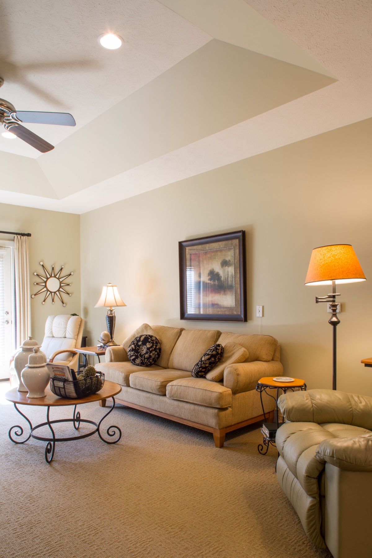 A cozy living room with comfortable seating and warm lighting.